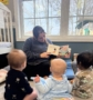 teacher reading to infants in classroom at preschool and daycare cadence academy preschool 502 spring hill