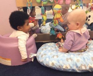 infants_making_silly_faces_at_eachother_at_next_generation_childrens_centers_hopkinton_ma-546x450