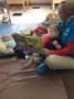 infants_reading_book_with_day_care_provider_at_phoenix_childrens_academy_private_preschool_thunderbird-333x450
