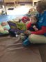 infants_reading_book_with_day_care_provider_at_phoenix_childrens_academy_private_preschool_thunderbird-333x450
