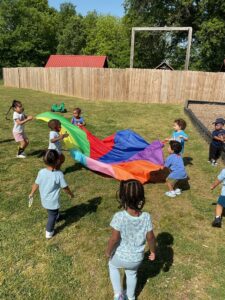 kids playing outside with parachute 503 cordova