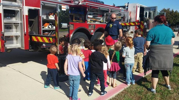 learning_about_the_equipement_on_a_fire_truck_at_cadence_academy_preschool_flower_mound_tx-752x423