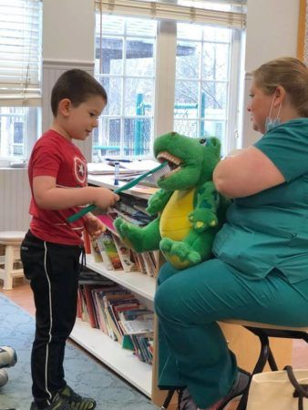 learning_how_to_brush_teeth_winwood_childrens_center_ashburn_va-338x450