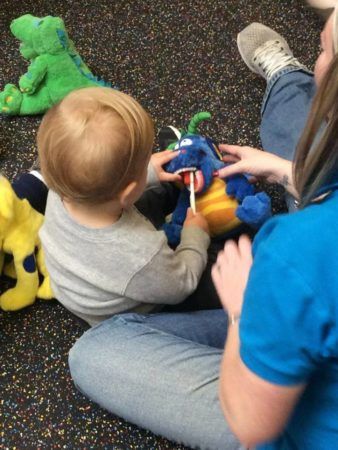 learning_to_brush_teeth_at_cadence_academy_preschool_hanover_ma-338x450