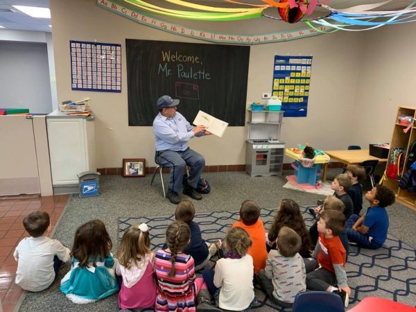 mailman_reading_book_to_class_jonis_child_care_preschool_burlington_ct-600x450