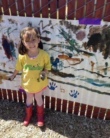 painting_a_mural_outdoors_cadence_academy_preschool_lacey_wa-357x450