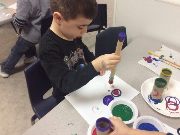 painting_with_cardboard_tubes_cadence_academy_preschool_urbandale_ia-600x450