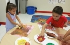 painting_with_corn_and_apples_phoenix_childrens_academy_private_preschool_surprise_az-700x450