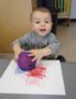 painting_with_spikey_ball_cadence_academy_preschool_clive_ia-344x450