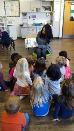 parent_reading_story_to_class_canterbury_academy_at_small_beginnings_overland_park_ks-253x450