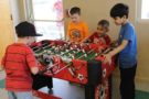 playing_foosball_at_cadence_academy_preschool_smoky_hill_aurora_co