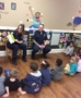 police_reading_to_preschoolers_at_sunbrook_academy_at_chapel_hill_douglasville_ga-371x450