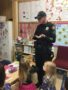 policeman_presentation_cadence_academy_preschool_milwaukie_portland_or-338x450