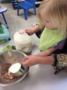 pouring_milk_during_cooking_activity_rogys_learning_place_pekin_il-333x450