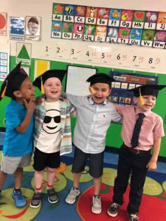 pre-kindergarten_boy_enjoying_graduation_creative_kids_childcare_centers_yorktown-338x450