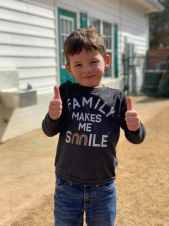 pre-kindergarten_boy_giving_thumbs_up_on_playground_sunbrook_academy_at_legacy_park_kennesaw_ga-338x450