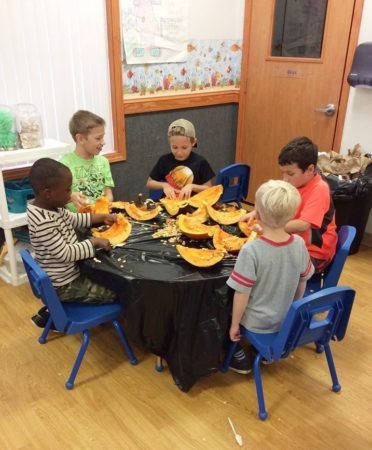 pre-kindergarten_boys_doing_pumpkin_project_sunbrook_academy_at_barnes_mill_austell_ga-372x450