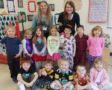 pre-kindergarten_children_and_teachers_in_mismatched_pajamas_cadence_academy_preschool_iowa_city_ia-558x450