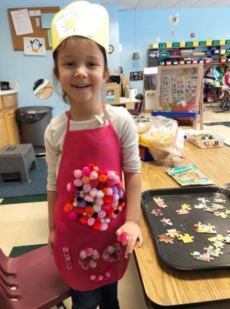 pre-kindergarten_girl_doing_puzzle_learning_edge_childcare_and_preschool_new_berlin_wi-336x450