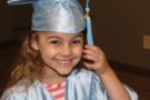 pre-kindergarten_girl_in_cap_and_gown_rogys_learning_place_lake_street_peoria_heights_il-675x450