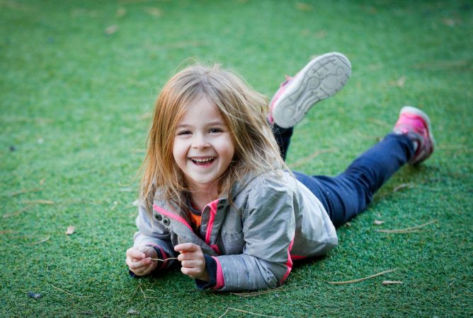 pre-kindergarten_girl_playing_on_playground-668x450