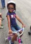 pre-kindergarten_girl_riding_tricycle_at_learning_edge_childcare_and_preschool_oak_creek_wi-321x450