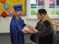 pre-kindergarten_graduate_and_teacher_cadence_academy_preschool_cooper_point_olympia_wa-593x450