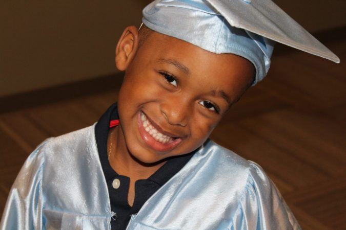 pre-kindergartener_excited_about_graduation_rogys_learning_place_lake_street_peoria_heights_il-675x450