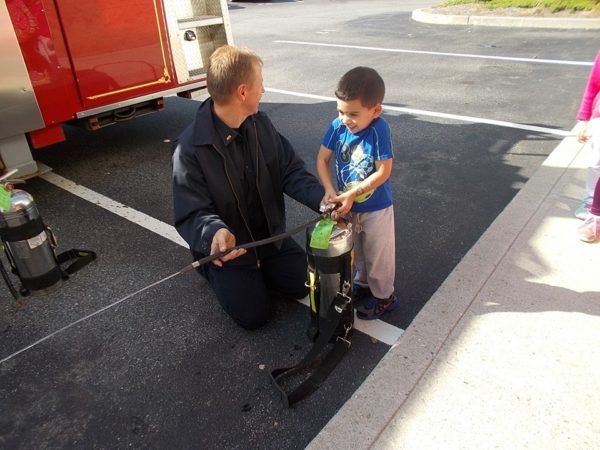 preschool_boy_and_firefighter_creative_kids_childcare_centers_yorktown-600x450
