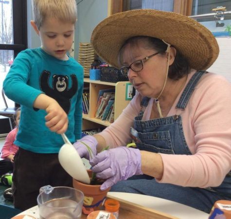 preschool_boy_and_teacher_planting_together_cadence_academy_preschool_johnston_ia-475x450