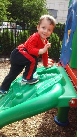 preschool_boy_climbing_on_playground_equipment_prime_time_early_learning_centers_paramus_nj-253x450