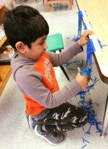 preschool_boy_cutting_activity_at_next_generation_childrens_centers_marlborough_ma-326x450