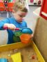 preschool_boy_digging_in_sand_at_cadence_academy_preschool_rosemeade_carrollton_tx-338x450