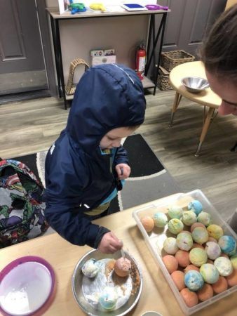 preschool_boy_doing_egg_experiment_cadence_academy_preschool_yelm_highway_olympia_wa-338x450