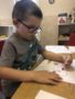 preschool_boy_drawing_with_markers_jonis_child_care_preschool_farmington_ct-338x450