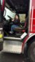 preschool_boy_enjoying_driving_a_fire_truck_cadence_academy_preschool_clackamas_or-253x450