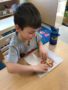 preschool_boy_enjoying_fun_healthy_snack_cadence_academy_preschool_tualatin_or-338x450