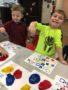 preschool_boy_enjoying_lego_stamp_activity_canterbury_academy_at_shawnee_crossings_shawnee_ks-338x450