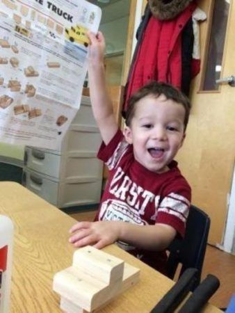 preschool_boy_excited_to_work_on_truck_at_next_generation_childrens_centers_marlborough_ma-338x450