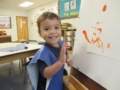 preschool_boy_fingerpainting_adventures_in_learning_aurora_il-600x450