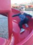 preschool_boy_going_down_slide_cadence_academy_preschool_greensboro_nc-336x450