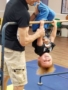 preschool_boy_hanging_upside_down_gymnastics_class_cadence_academy_preschool_myrtle_beach_sc-338x450
