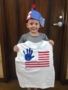 preschool_boy_holding_american_flag_handprint_t-shirt_canterbury_academy_at_shawnee_crossings_shawnee_ks-338x450