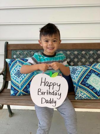 preschool_boy_holding_happy_birthday_sign_sunbrook_academy_at_legacy_park_kennesaw_ga-338x450