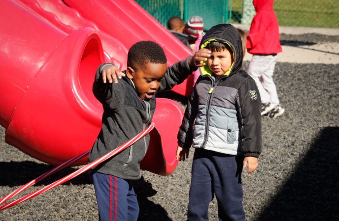 preschool_boy_hula_hoop_playground_cadence_academy_north_aurora_il-688x450