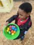 preschool_boy_hunting_for_easter_eggs_cadence_academy_preschool_tacoma_wa-338x450