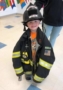 preschool_boy_in_fire_fighter_uniform_learning_edge_childcare_and_preschool_oak_creek_wi-317x450