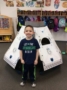 preschool_boy_in_front_of_space_capsule_toy_adventures_in_learning_oswego_il-336x450