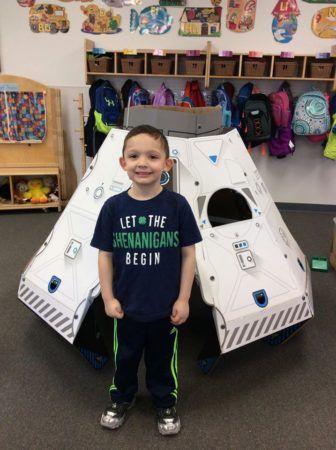 preschool_boy_in_front_of_space_capsule_toy_adventures_in_learning_oswego_il-336x450