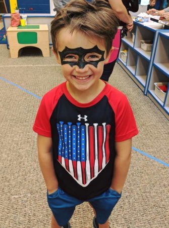 preschool_boy_in_painted_batman_mask_rogys_learning_place_hilltop_peoria_il-335x450